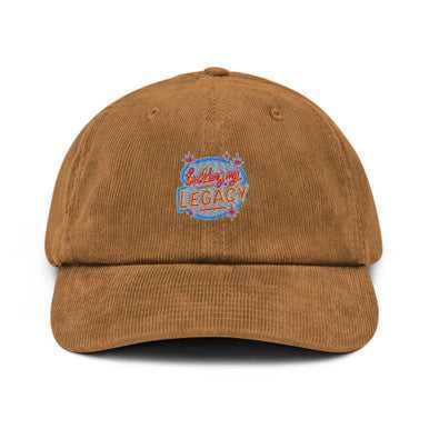 Building My Legacy corduroy cap in brown ribbed fabric, featuring a curved brim and colorful embroidered front logo.