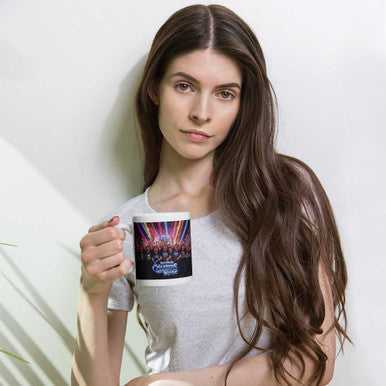 MCM On Stage ceramic mug with a black printed design and white interior, featuring a concert stage graphic and handle.