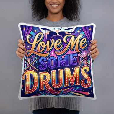 Love Me Some Drums pillow with a colorful printed design, bold lettering, musical notes, and white edges