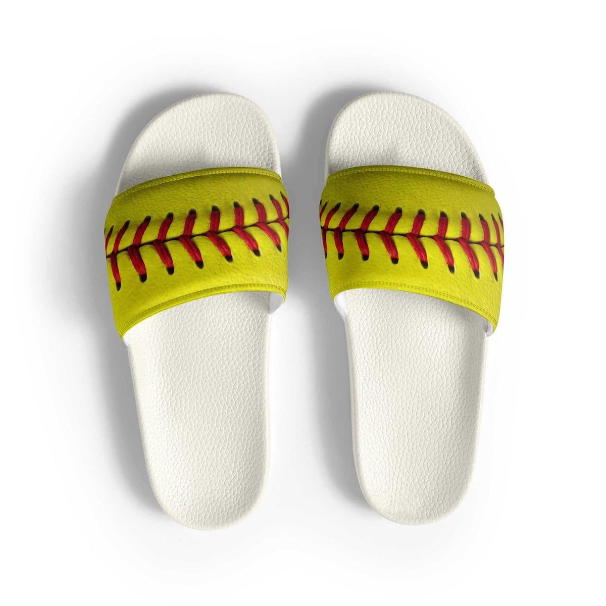 Women's slides with white textured footbeds and optic yellow straps featuring a bold red and black softball seam pattern.